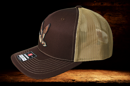 Brown and tan hat with brown flying duck