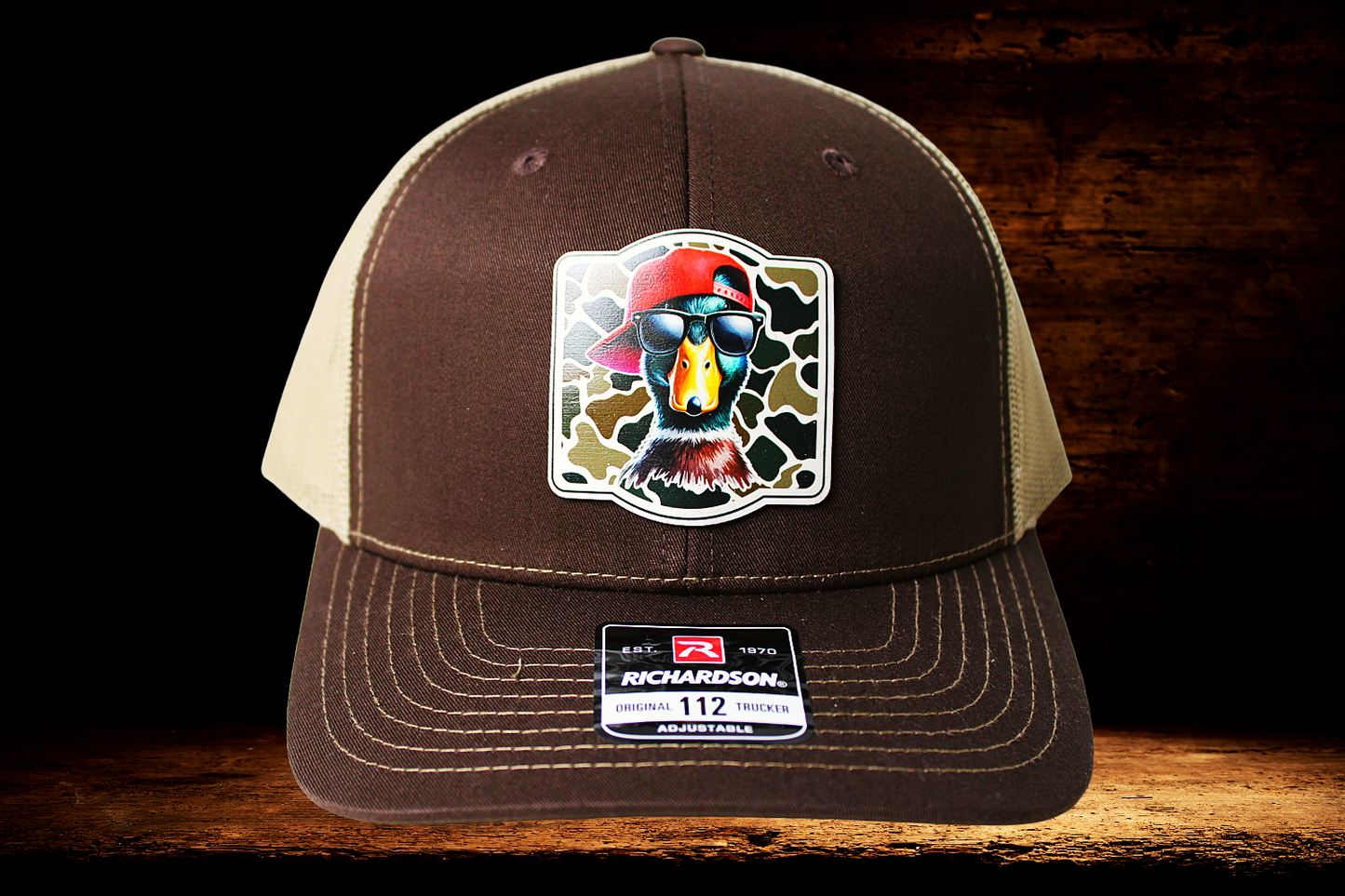 Brown and tan hat with cool duck patch