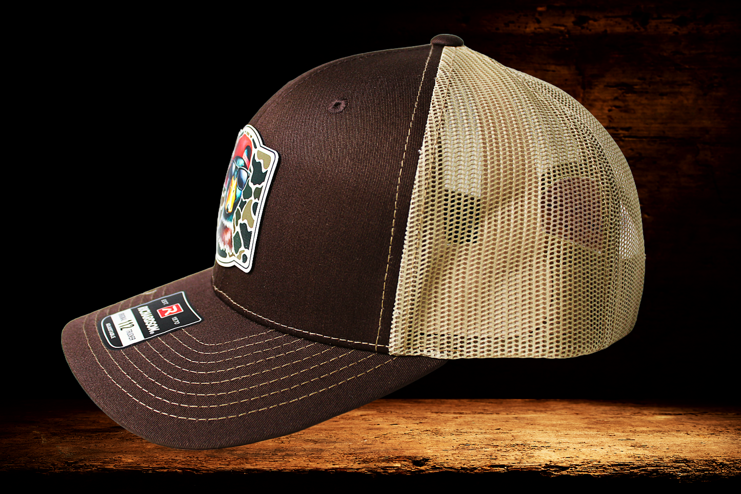Brown and tan hat with cool duck patch