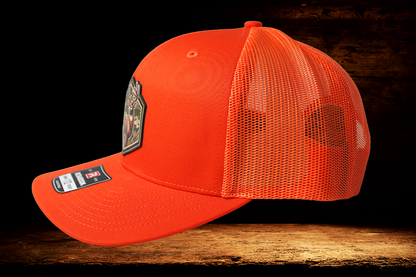 Hunting orange hat with colorful deer patch