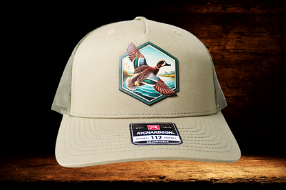 Flying duck portrait on khaki hat